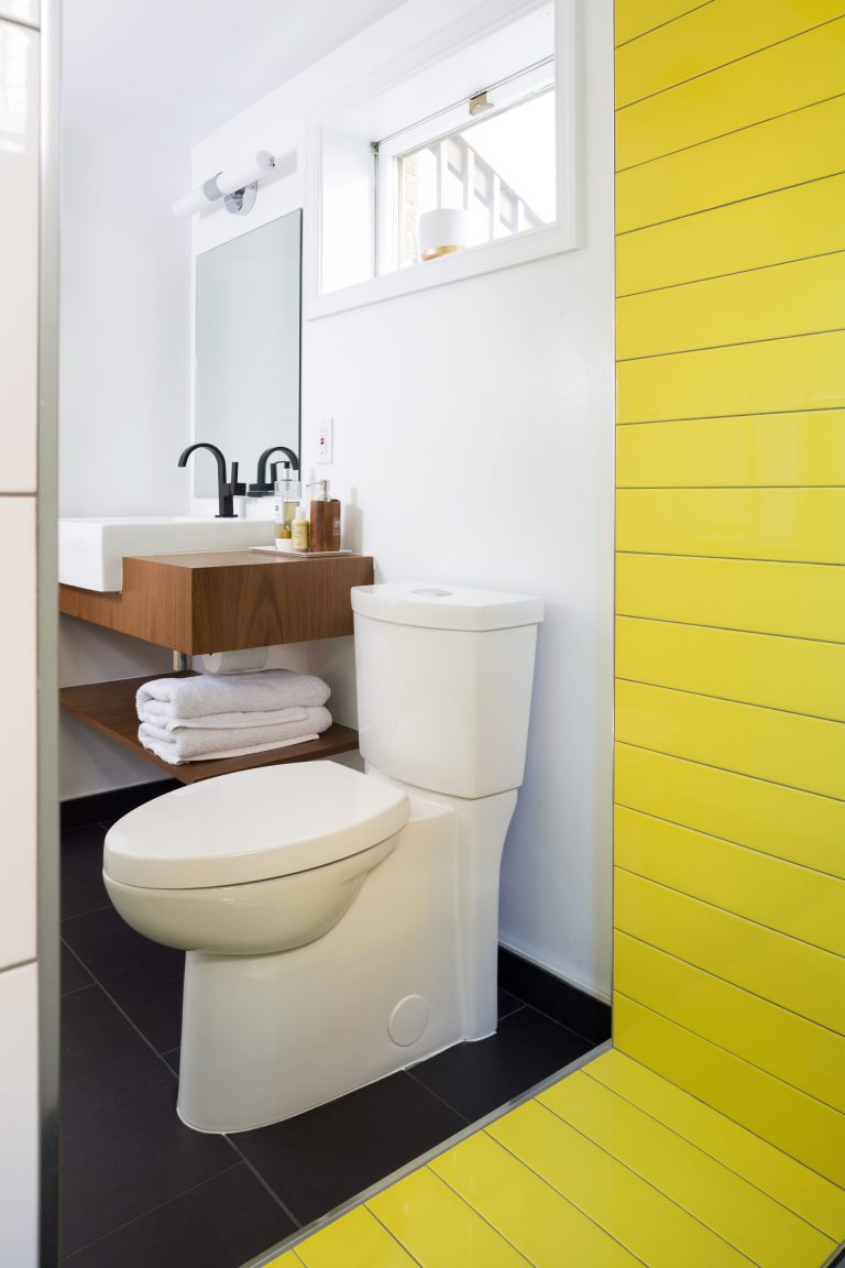 bright modern bathroom neutral colors with pop of yellow