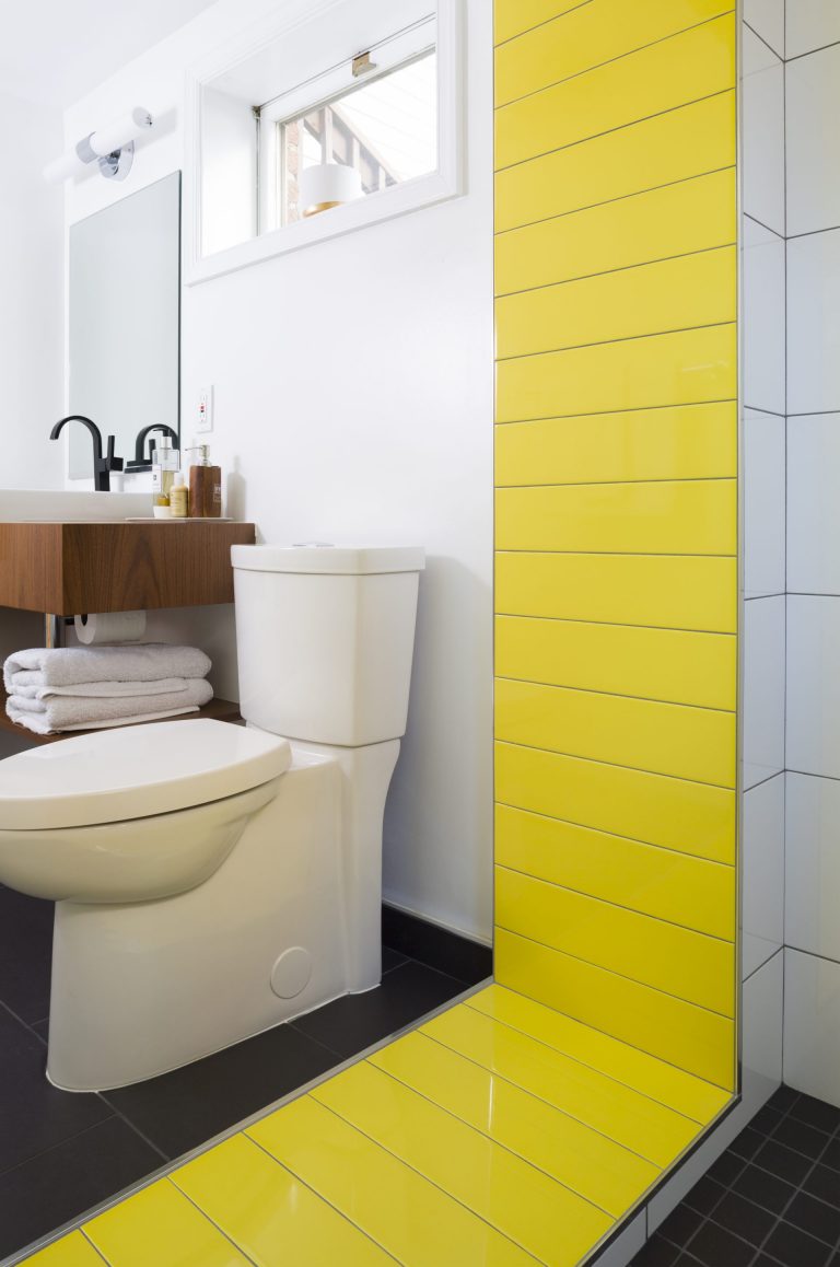 bright modern bathroom neutral colors with pop of yellow