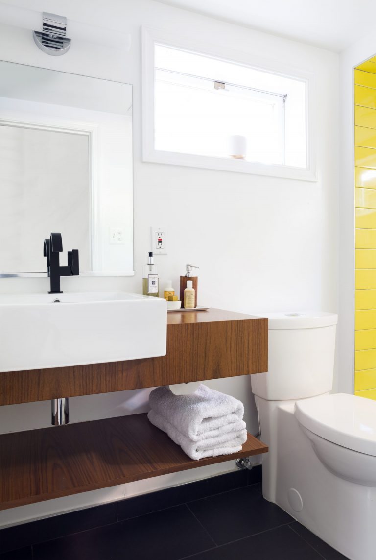 natural wood floating vanity in modern bathroom