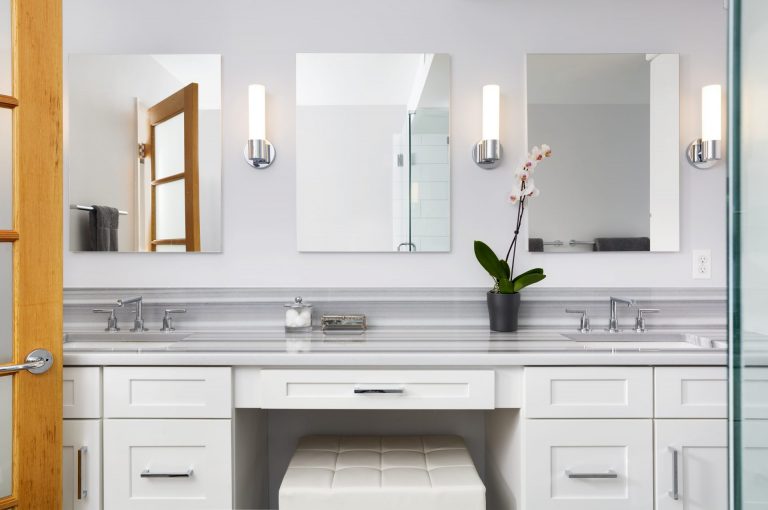 glamorous bathroom double sinks and built-in makeup vanity light gray color palette