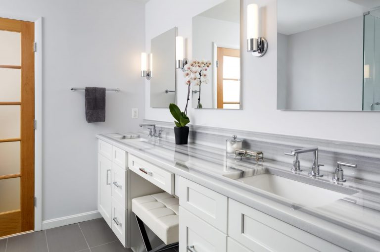 glamorous bathroom double sinks and built-in makeup vanity light gray color palette equador marble countertops