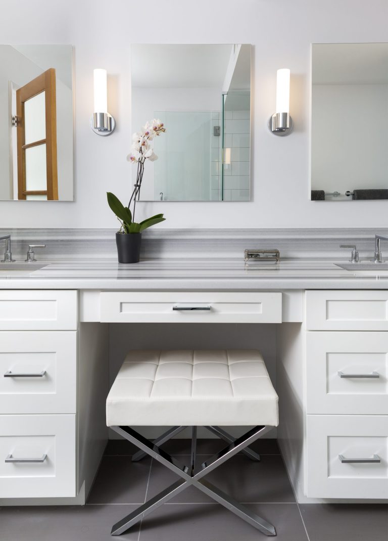 glamorous bathroom double sinks and built-in makeup vanity light gray color palette