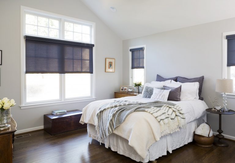 relaxing bedroom remodel gray and navy blue angled ceiling dark wood floors