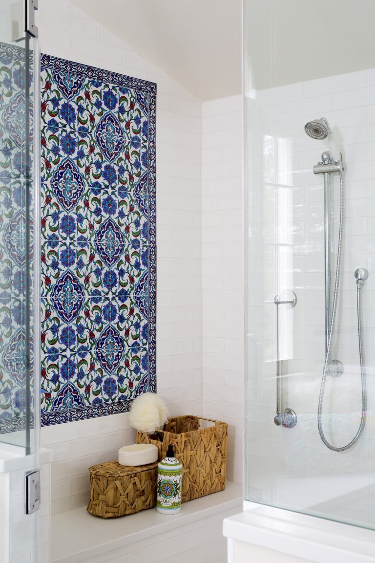 built in bench and blue mosaic tile feature in shower