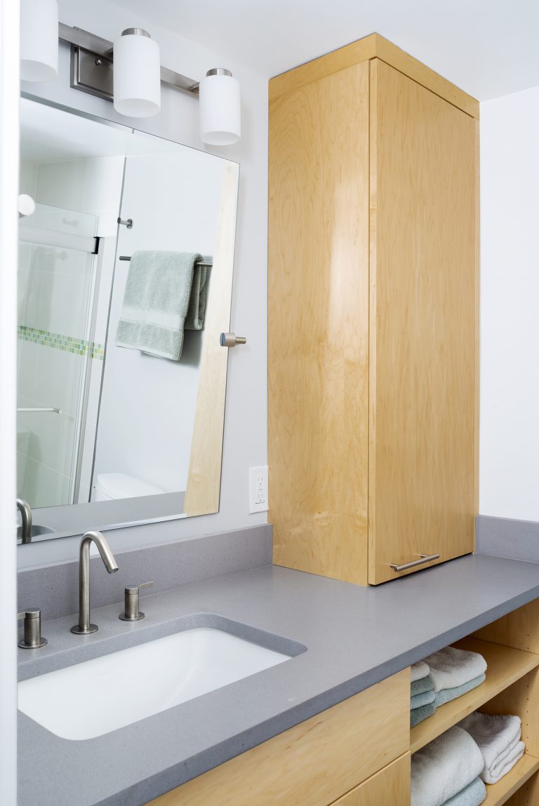 modern bathroom design light wood vanity open shelving plenty of storage sconce lighting
