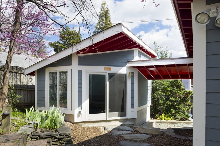 outdoor living area red and blue modern architecture sliding glass doors