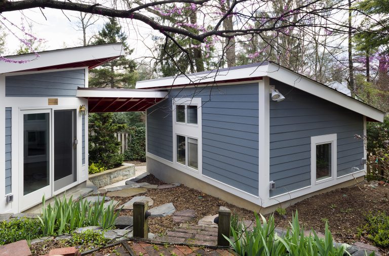 outdoor living area red and blue modern architecture sliding glass doors