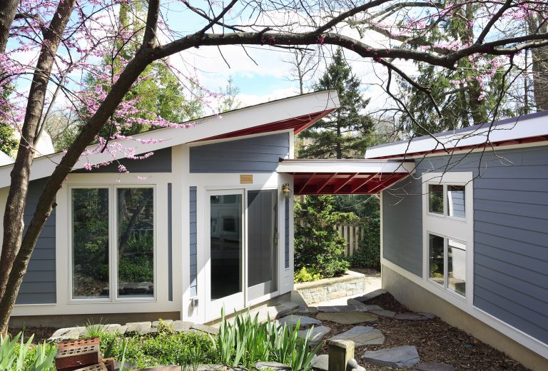 outdoor living area red and blue modern architecture sliding glass doors