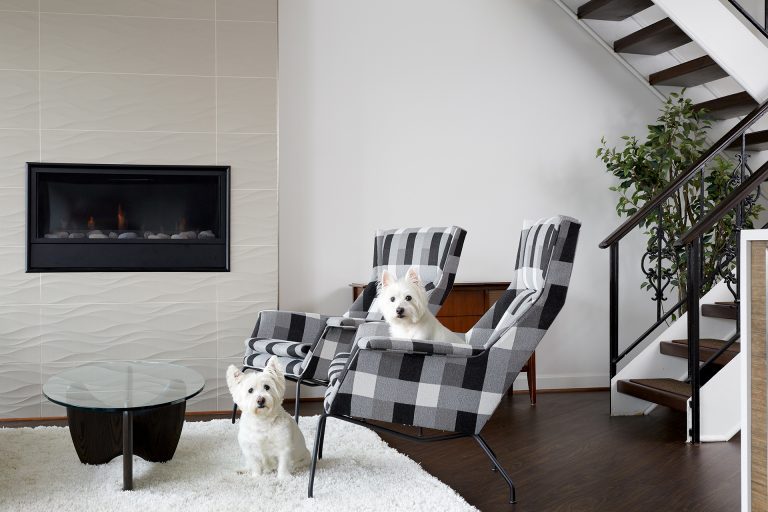 modern living room renovation textured fireplace open stairs black and white