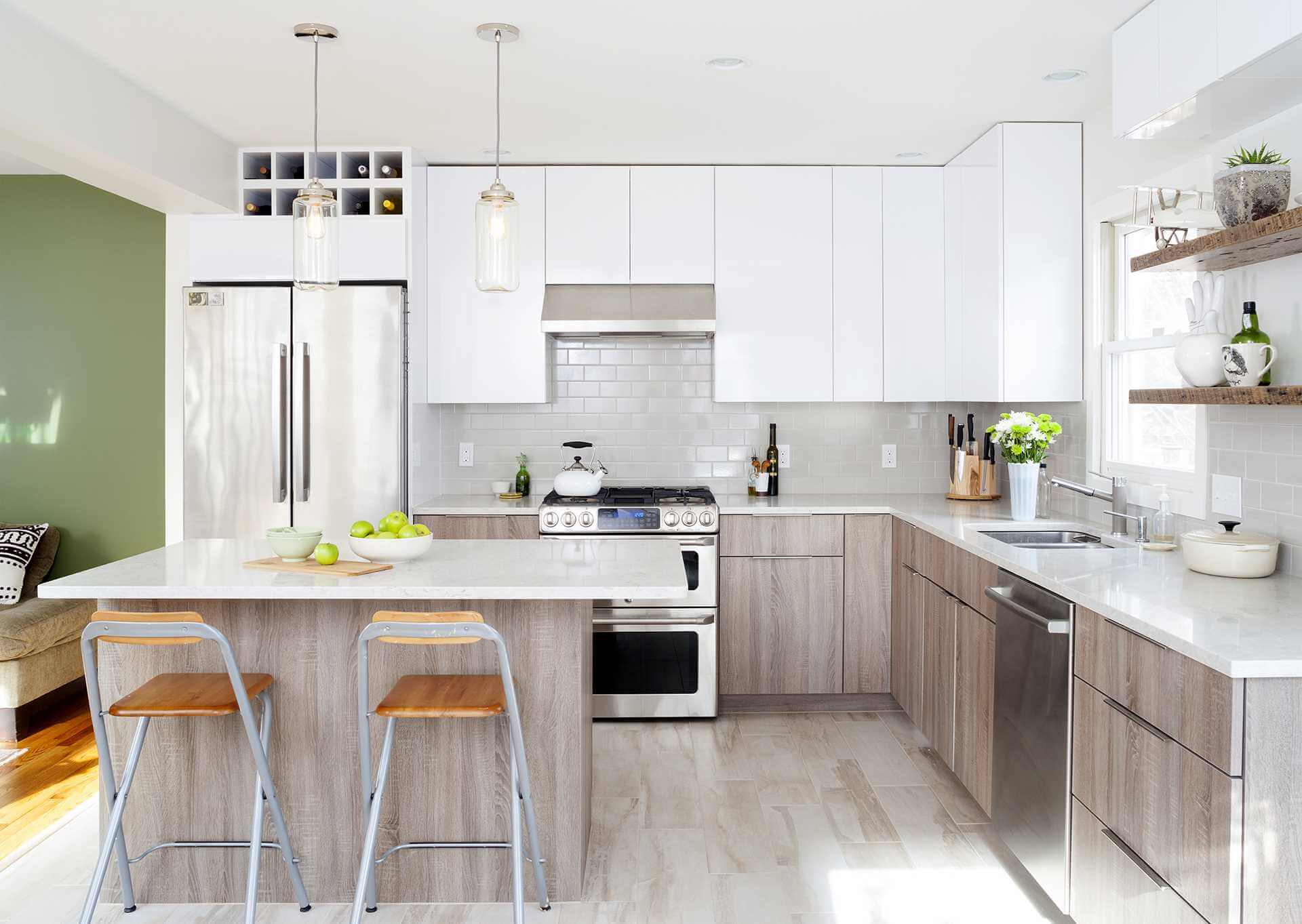 White kitchen with subway tile and quartz counter tops