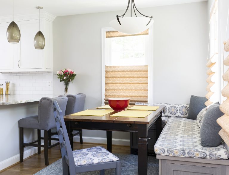 dining area with banquette seating blue and gray color palette