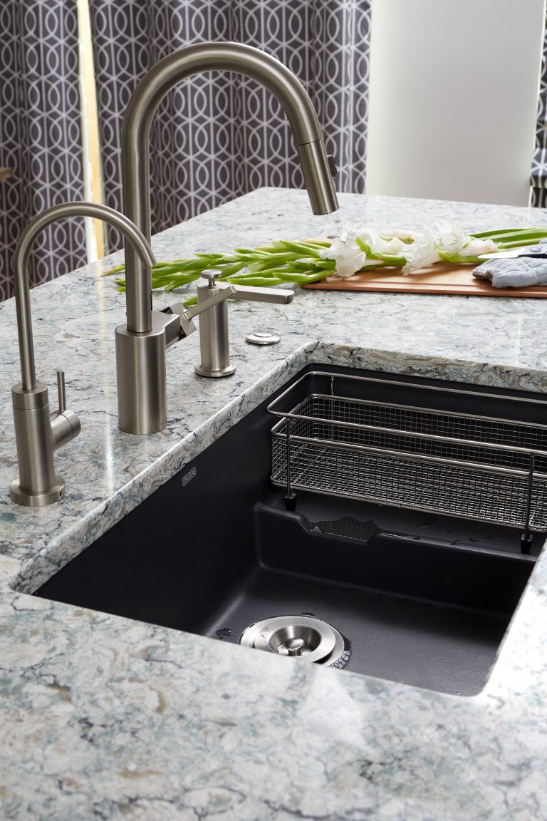 large kitchen sink with brushed chrome fixtures separate water spout