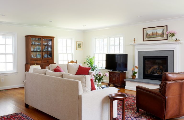 traditional living area light and bright with large windows and wood floors