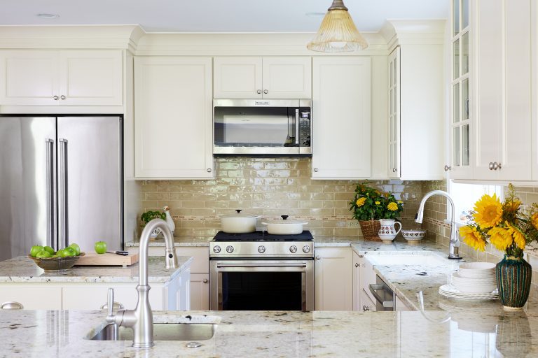 classic kitchen cream cabinets neutral color palette stainless steel appliances