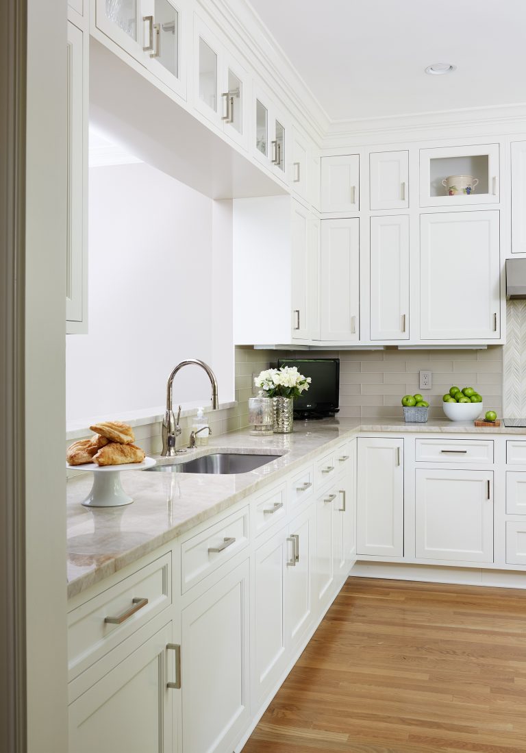 white and neutral toned kitchen with wood floors