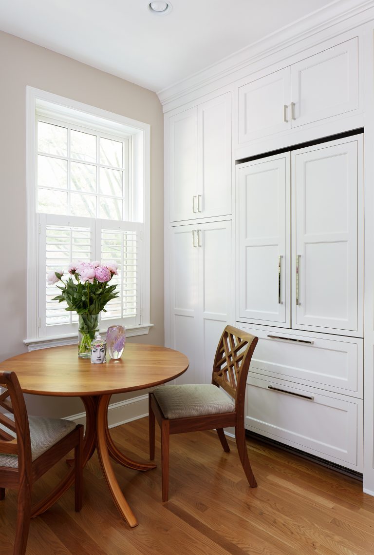 kitchen eat in area and paneled refrigerator