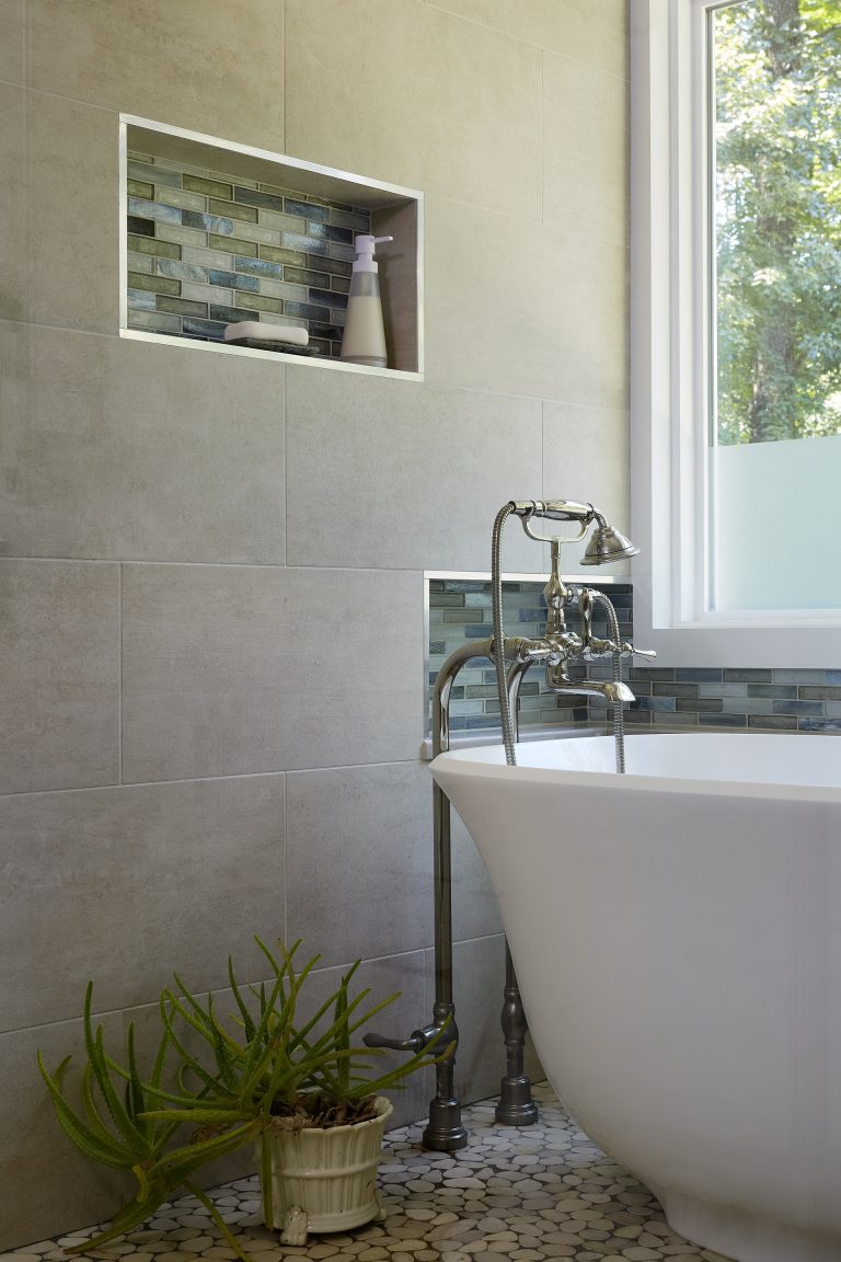 freestanding bathtub with accessible storage nooks accent tiles in nook stainless steel trim natural color palette