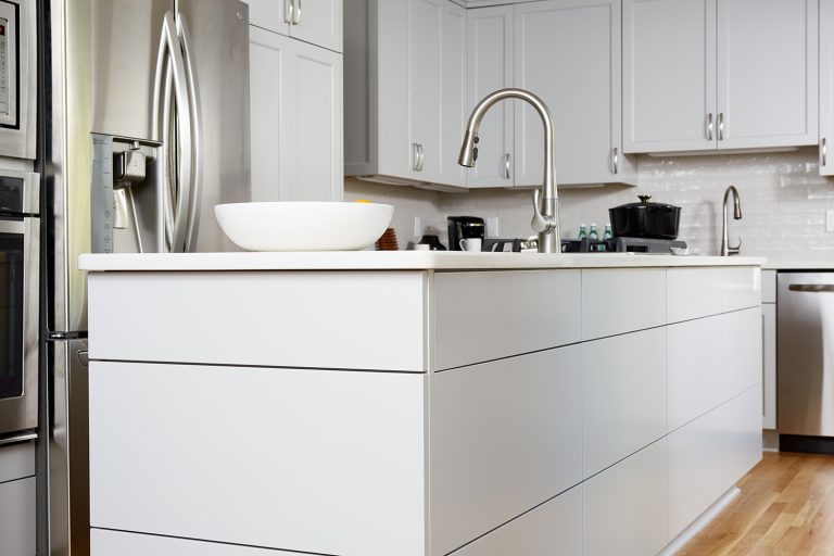 kitchen island with sink white cabinetry