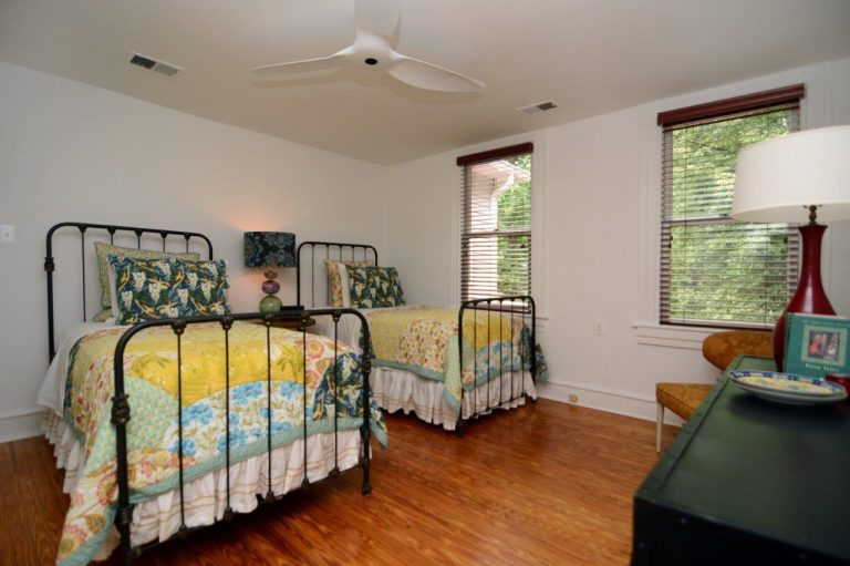 bedroom renovation white walls wood floors