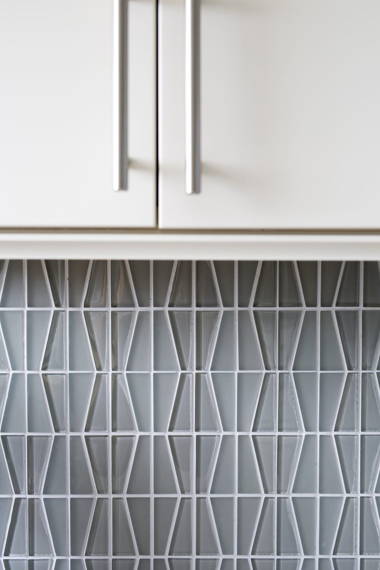 close up of geometric tile kitchen backsplash