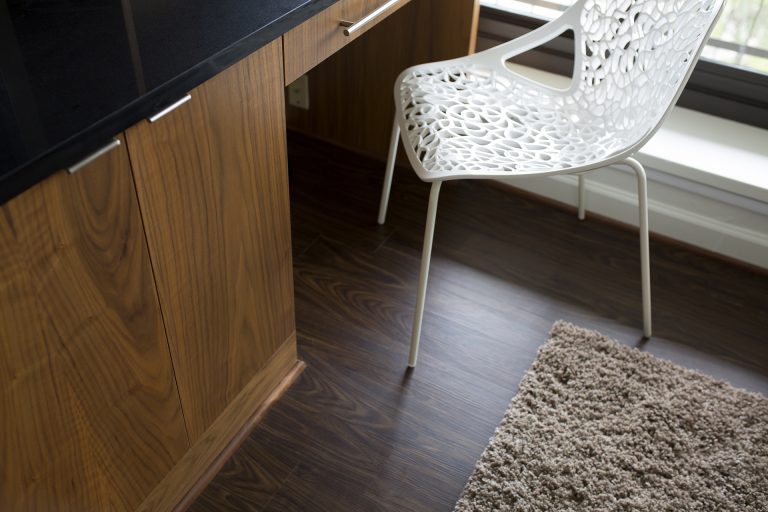 close up of built in desk area and wood floor dual wood tones