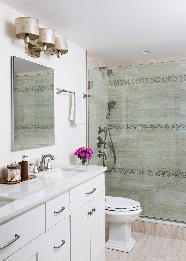 neutral color palette bathroom white cabinet vanity with double sinks shower with glass wall