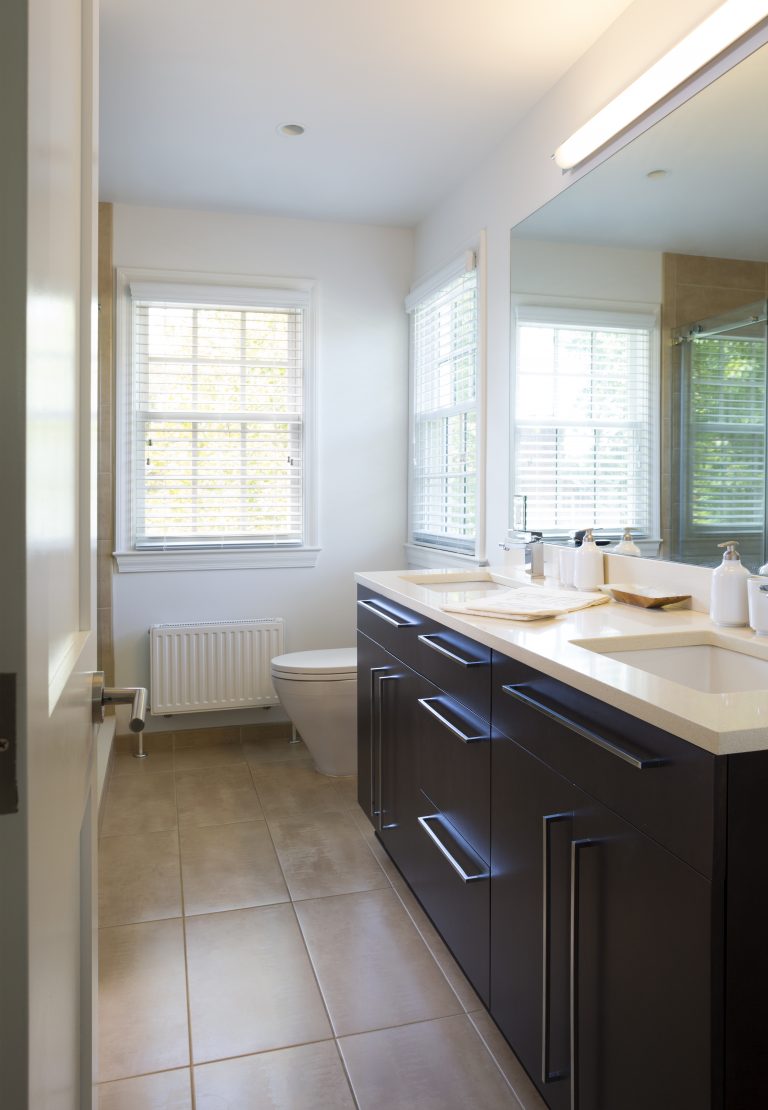 renovated bathroom neutral color palette with double sink vanity