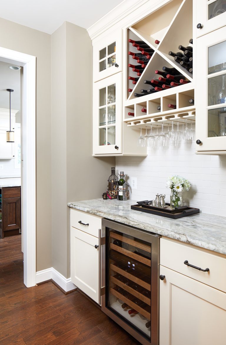 minibar area in kitchen cream cabinetry with glass door uppers beverage refrigerator wine storage