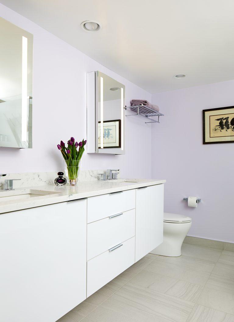 bathroom with light purple walls white floating vanity with double sinks recessed lighting