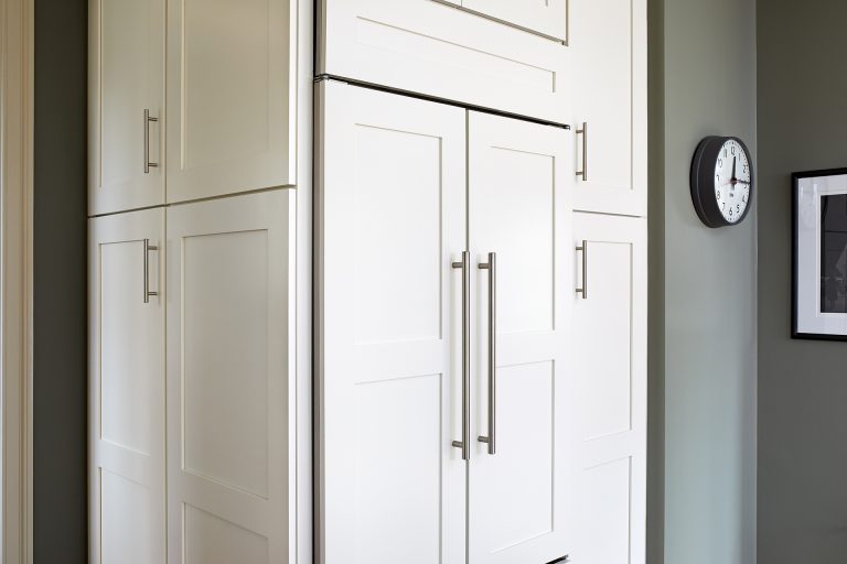 white cabinetry paneled refrigerator