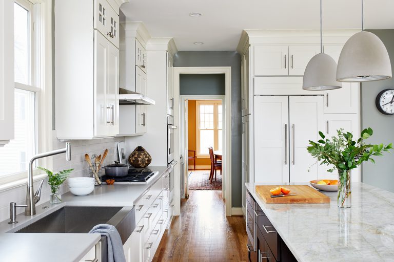 view from renovated kitchen into dining area stainless steel apron sink