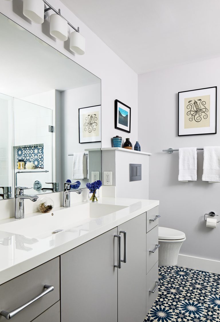 bathroom vanity gray cabinetry and double sink with polished chrome fixtures