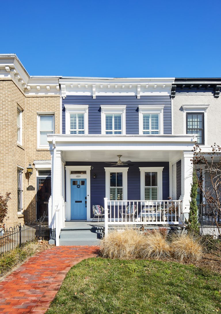blue DC town home with brick pathway
