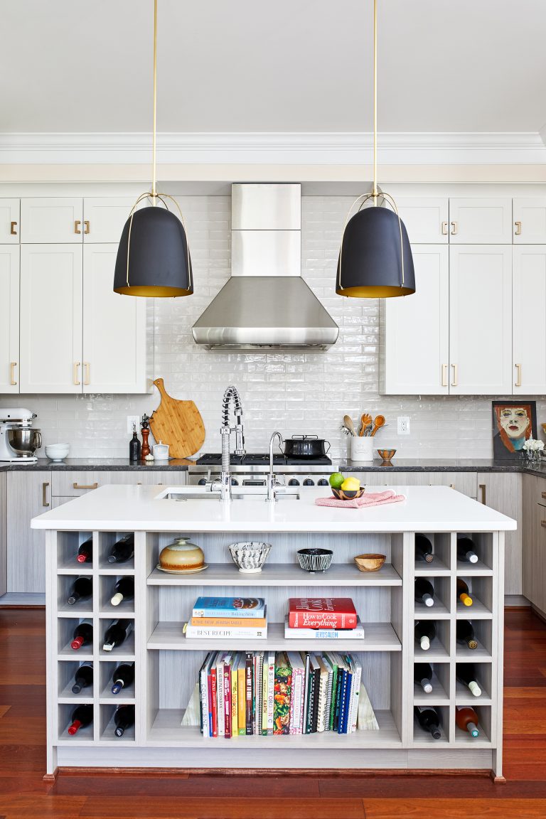 white kitchen with wood floors stainless steel appliances island with open shelf storage