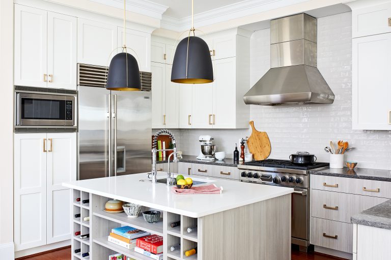 white kitchen floor to ceiling cabinetry crown molding island with open shelving