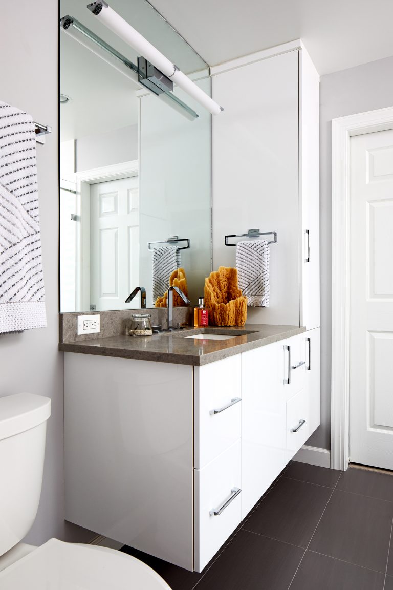 bathroom neutral and white cabinetry floating vanity and large mirror