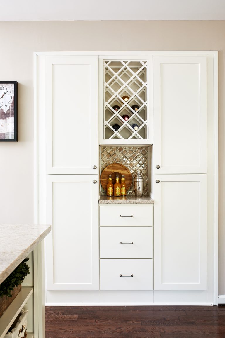 built in pantry white floor to ceiling cabinetry and wine bottle storage