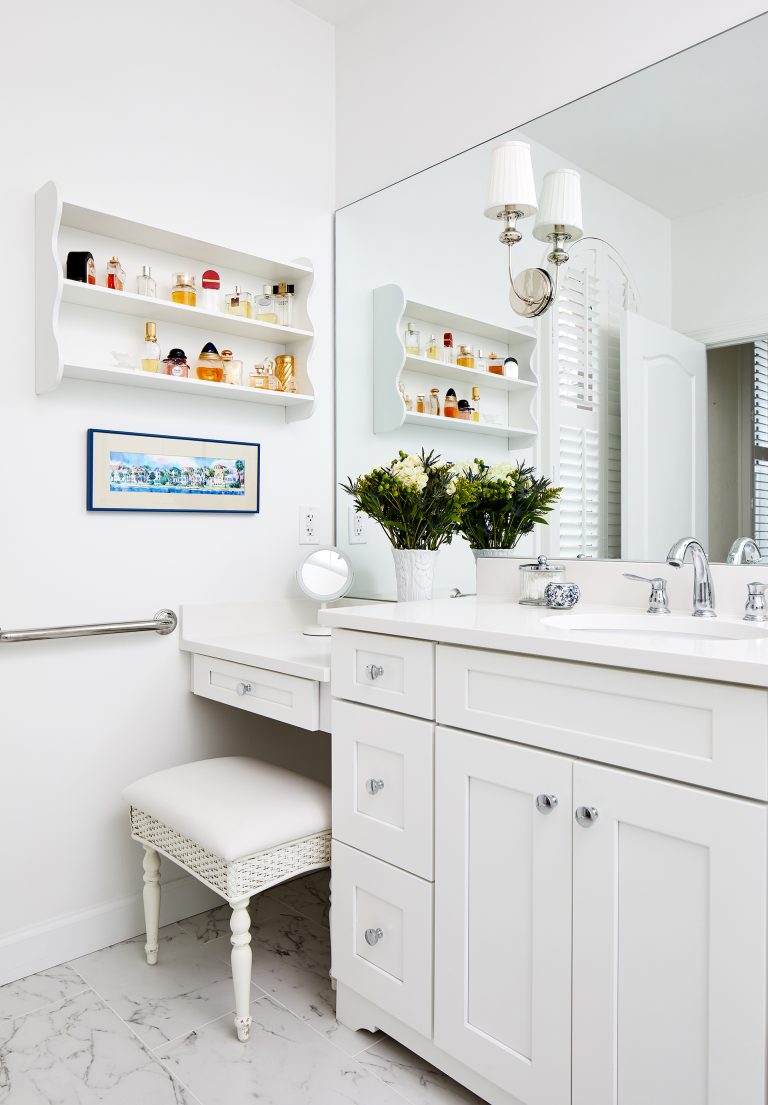 vanity with white cabinets and floating white shelf
