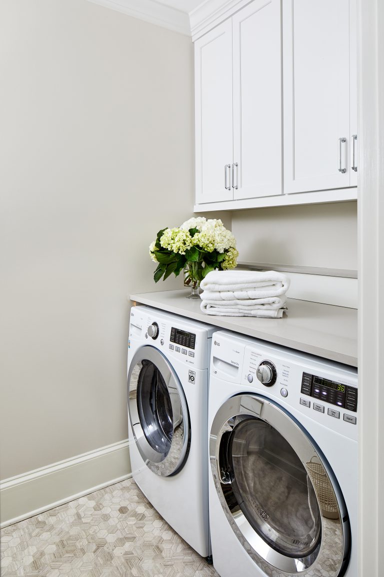 white laundry room cabinets set consist of four wall cabinets with large capacity washer & dryer