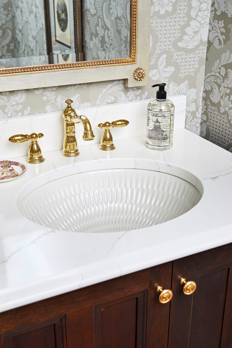 ceramic oval undermount bathroom sink with overflow with brushed gold two handle bathroom faucet