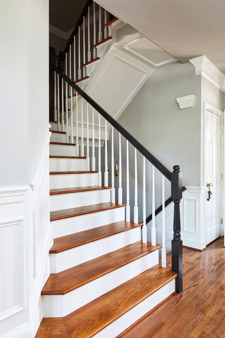 wood curved staircase, wood stairs with black wood bannister