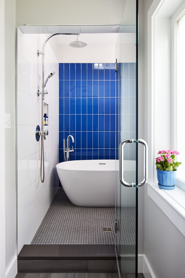 large bathroom with tub inside a spacious shower