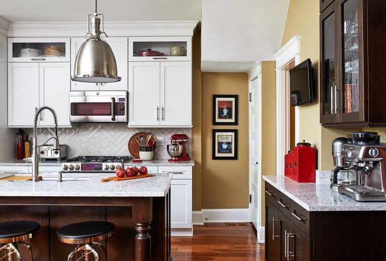 dc design build kitchen with tile backsplash, over the range built in microwave and kitchen cabinets with glass doors on top