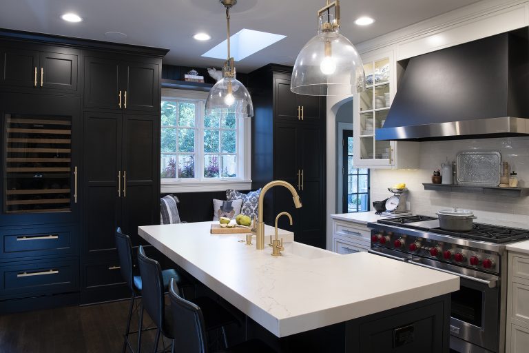 transitional kitchen island with sitting and hanging light fixtures