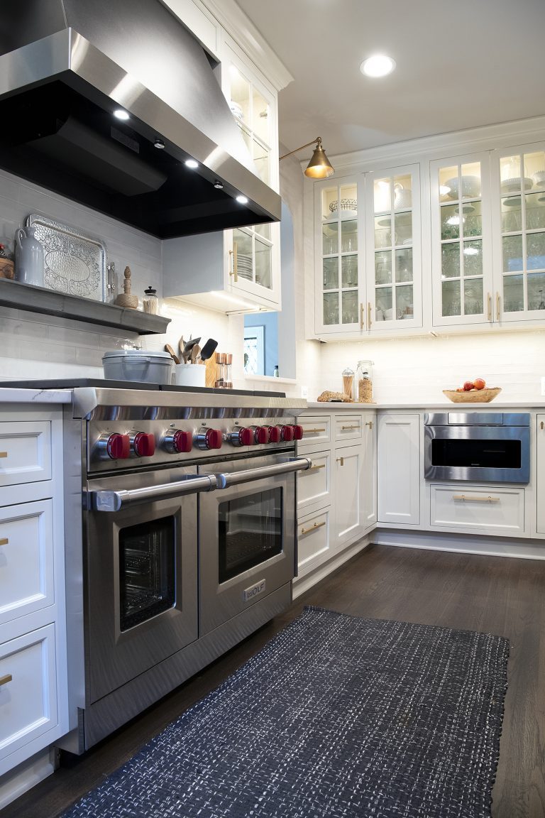 kitchen design with 6 burner stove top with double over and wood floors