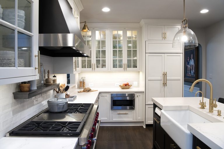 kitchen remodeling with stainless steel range top with 6 burners and griddle, farmhouse white sink, white cabinets with pull handles