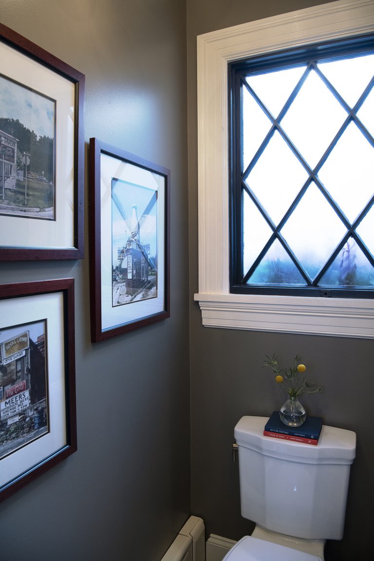 remodeling bathroom with large window over the toilet