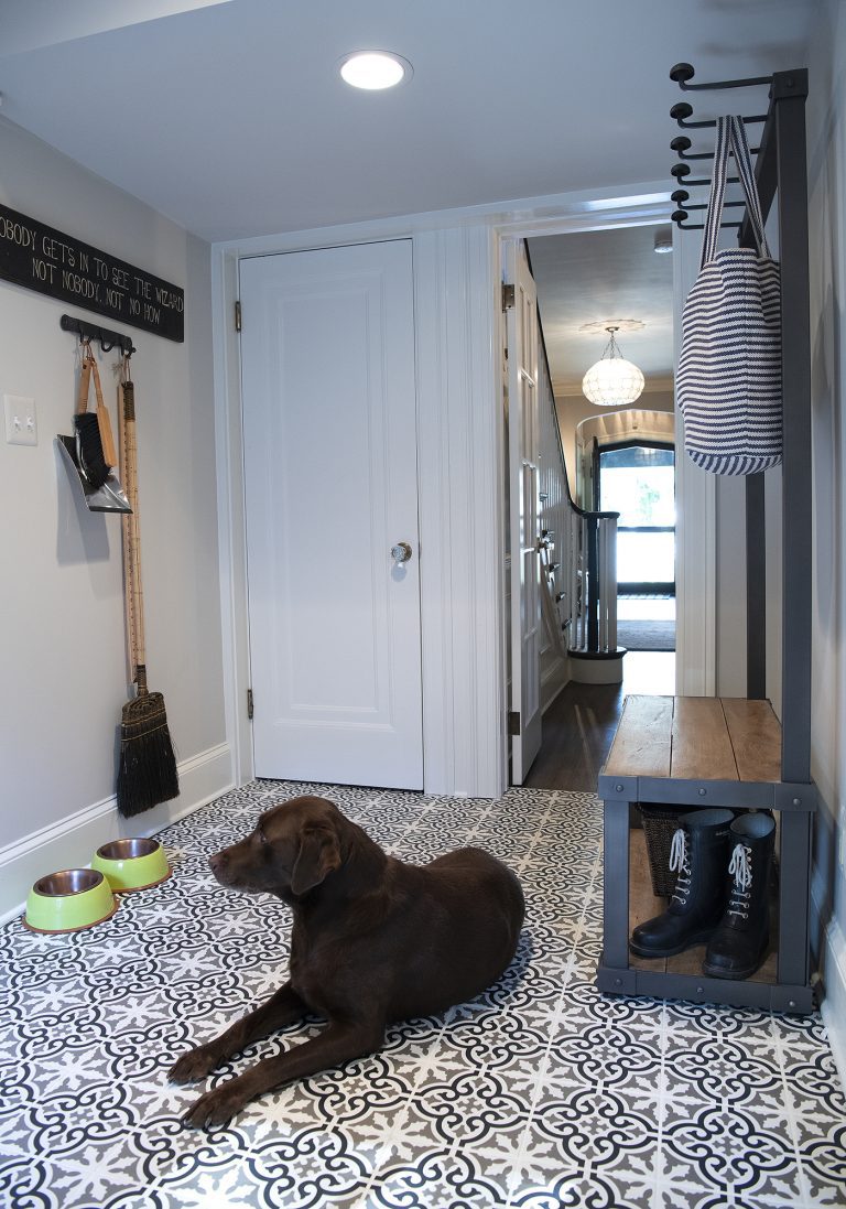 large wooden bench with coat racks