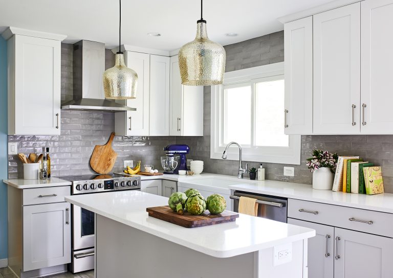 kitchen remodeling with white cabinets with pull handles, large farmhouse white sink, stainless steel dish washer and burner with hood range