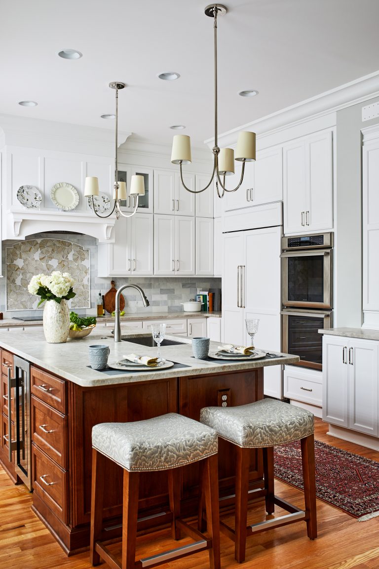 home remodeling kitchen marble counter, area rug and island with seating